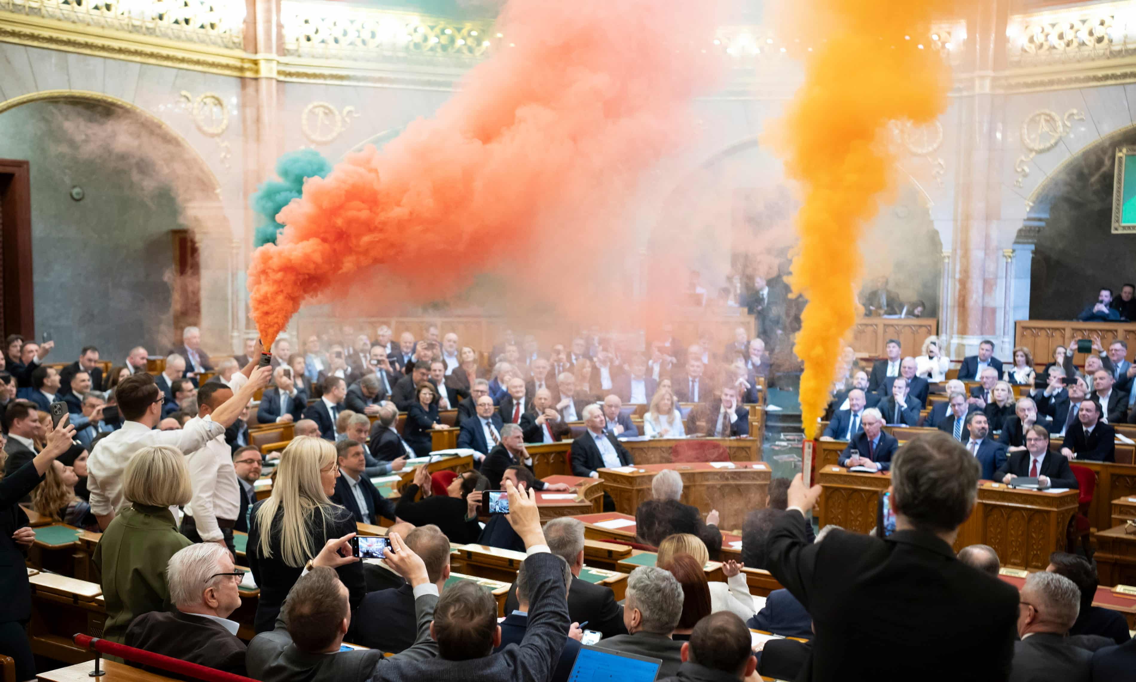 Opposition MPs set off flares in the Hungarian parliament. Photograph: Boglárka Bodnár/AP